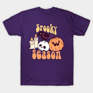 Spooky season a cute crow on a skull with a pumpkin and candles T-Shirt